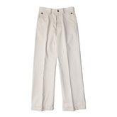 A pair of beige, high-waisted, wide leg chino pants with brass front fruit buckle closure.