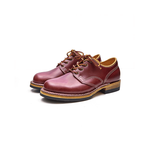 A pair of men's broad toe derbies in burgundy color with a lace-up closure, displayed against a white background.