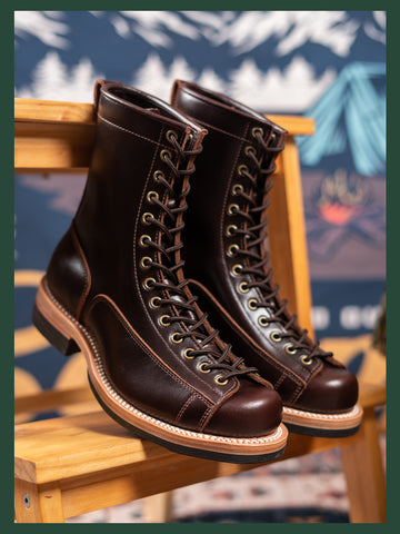 A pair of men's tall monkey boots in black color with lace-up closure and leather soles.